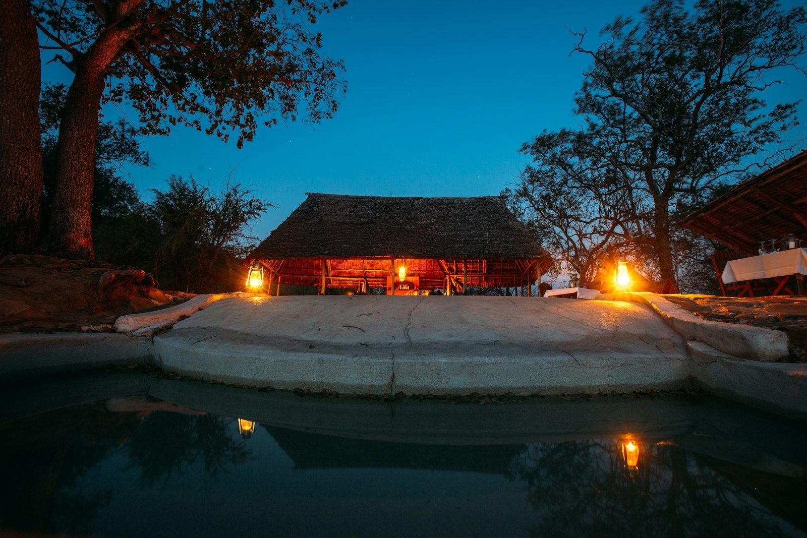 Safari lodge illuminated at dusk